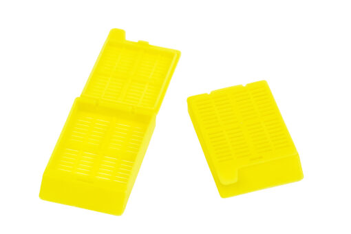 yellow slotted cassettes with attached lids
