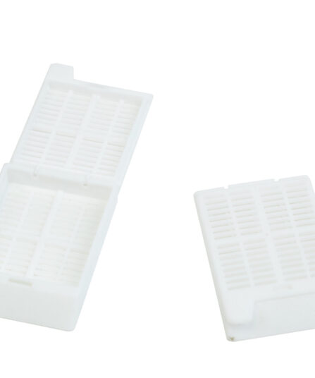 white slotted cassettes with attached lids